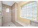 Walk-in shower with tiled walls and glass enclosure at 188 Broadmoor Ln, Rotonda West, FL 33947
