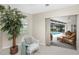Bright sunroom with wicker furniture, overlooking a refreshing pool and patio at 188 Broadmoor Ln, Rotonda West, FL 33947