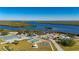Aerial view of community with tennis courts, basketball court, playground, and river access at 2329 Pinellas Dr, Punta Gorda, FL 33983