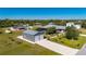 Aerial view showing a house, detached garage, and expansive grassy yard at 2329 Pinellas Dr, Punta Gorda, FL 33983