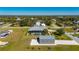 Aerial view of a house with pool, detached garage, and large backyard at 2329 Pinellas Dr, Punta Gorda, FL 33983