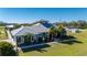 Aerial view of a single-Gathering home with a metal roof and a large backyard at 2329 Pinellas Dr, Punta Gorda, FL 33983
