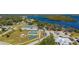 Aerial view showing community amenities including tennis and basketball courts near the river at 2329 Pinellas Dr, Punta Gorda, FL 33983