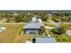 Aerial view of a house with a pool, detached garage and basketball court at 2329 Pinellas Dr, Punta Gorda, FL 33983