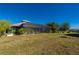 Large backyard with screened enclosure and lush landscaping at 2329 Pinellas Dr, Punta Gorda, FL 33983