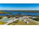 Aerial view of community including tennis courts, shuffleboard, and river access at 2329 Pinellas Dr, Punta Gorda, FL 33983