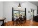 Bright dining room with hardwood floors and view of the pool at 2329 Pinellas Dr, Punta Gorda, FL 33983