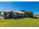 Single-Gathering home with metal roof and lush tropical landscaping at 2329 Pinellas Dr, Punta Gorda, FL 33983