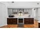 Stainless steel appliances and dark wood cabinets in this updated kitchen at 2329 Pinellas Dr, Punta Gorda, FL 33983