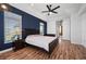 Main bedroom with hardwood floors, a ceiling fan and large windows at 2329 Pinellas Dr, Punta Gorda, FL 33983
