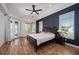 Spacious main bedroom with hardwood floors and a ceiling fan at 2329 Pinellas Dr, Punta Gorda, FL 33983