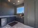 Outdoor kitchen with grill, sink, and mini-fridge at 2329 Pinellas Dr, Punta Gorda, FL 33983