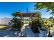 Charming pergola pathway leading to the home entrance at 2329 Pinellas Dr, Punta Gorda, FL 33983