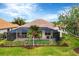 View of the backyard with screened in pool and patio at 25187 Keygrass Ct, Punta Gorda, FL 33955