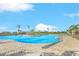 Large community pool area with palm trees and comfortable lounge seating at 25187 Keygrass Ct, Punta Gorda, FL 33955