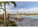 Relaxing community pool area with lounge chairs and a tropical landscape at 25187 Keygrass Ct, Punta Gorda, FL 33955