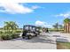 Golf carts parked on the driveway next to the community at 25187 Keygrass Ct, Punta Gorda, FL 33955