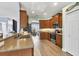 Well-lit kitchen features granite countertops, stainless steel appliances, and ample cabinet space at 25187 Keygrass Ct, Punta Gorda, FL 33955