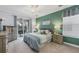 Cozy bedroom with a large window overlooking the lanai and a king-sized bed at 25187 Keygrass Ct, Punta Gorda, FL 33955