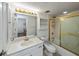 Bright bathroom, white vanity, shower/tub combo, and gold accents at 25188 Marion Ave # D205, Punta Gorda, FL 33950