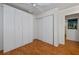 Bedroom with double closet and ceiling fan at 25188 Marion Ave # D205, Punta Gorda, FL 33950