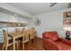 Dining area with light wood table and chairs near kitchen at 25188 Marion Ave # D205, Punta Gorda, FL 33950
