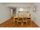 Dining area with light wood table and chairs near kitchen at 25188 Marion Ave # D205, Punta Gorda, FL 33950
