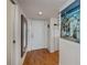 Bright condo entryway with wood floors and coastal decor at 25188 Marion Ave # D205, Punta Gorda, FL 33950