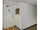 Residential hallway with a white door and wall art at 25188 Marion Ave # D205, Punta Gorda, FL 33950