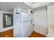 White kitchen appliances and stackable washer and dryer at 25188 Marion Ave # D205, Punta Gorda, FL 33950