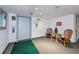 Welcoming lobby with elevator and seating for residents at 25188 Marion Ave # D205, Punta Gorda, FL 33950