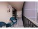 Spacious screened balcony with wicker chairs, offering peaceful views at 25188 Marion Ave # D205, Punta Gorda, FL 33950