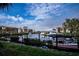 Calm canal with private boat docks and lush landscaping at 25188 Marion Ave # D205, Punta Gorda, FL 33950