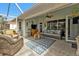 Screened porch with wicker furniture and backyard view at 2577 Mauritania Rd, Punta Gorda, FL 33983