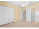 Bedroom with double door closet and bathroom access at 26346 Rampart Blvd # 904, Punta Gorda, FL 33983