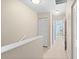 Upstairs hallway with linen closet and access to bedrooms at 26346 Rampart Blvd # 904, Punta Gorda, FL 33983