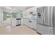 Bright kitchen with stainless steel appliances and white cabinets at 26346 Rampart Blvd # 904, Punta Gorda, FL 33983