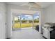 Screened patio with grill and backyard view at 26346 Rampart Blvd # 904, Punta Gorda, FL 33983
