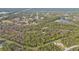 Aerial view of property near highway, showing home and landscape at 3000 Narcissus Ter, North Port, FL 34286