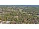 Aerial view of property with home nestled in lush surroundings at 3000 Narcissus Ter, North Port, FL 34286