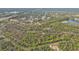 Aerial view of property with canal and trees at 3000 Narcissus Ter, North Port, FL 34286