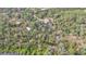 Aerial view showing home, pool, and outbuildings at 3000 Narcissus Ter, North Port, FL 34286