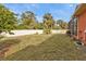 Large backyard with lush grass and privacy fence at 3000 Narcissus Ter, North Port, FL 34286