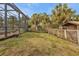 Large backyard with a pool, shed, and tropical landscaping at 3000 Narcissus Ter, North Port, FL 34286