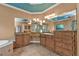Double vanity with wood cabinets and granite countertop at 3000 Narcissus Ter, North Port, FL 34286