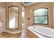 Spa-like bathroom with soaking tub and walk-in shower at 3000 Narcissus Ter, North Port, FL 34286