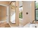 Walk-in shower with glass enclosure and pebble floor at 3000 Narcissus Ter, North Port, FL 34286