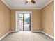 Bedroom with sliding glass doors leading to the patio at 3000 Narcissus Ter, North Port, FL 34286