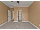 Spacious bedroom with neutral walls, carpet, and walk-in closet at 3000 Narcissus Ter, North Port, FL 34286
