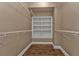 Large walk-in closet with wire shelving and wood floor at 3000 Narcissus Ter, North Port, FL 34286